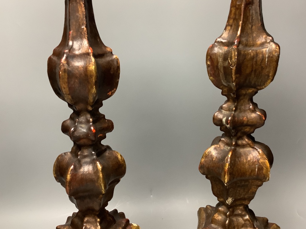 A pair of Italian Baroque style giltwood candlesticks 55cm